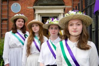 Four suffragettes outside the Centre 